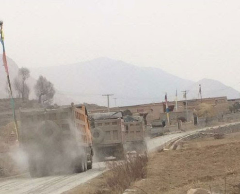 Mining trucks move along a road in Yadzi county, Qinghai, in an undated photo. Photo courtesy of an RFA listener