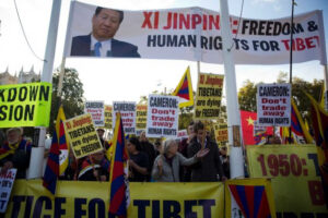 Senior Chinese pro-democracy campaigners protesting Britain’s treatment of an activist detained during Chinese President Xi Jinping’s pageant-filled visit to Britain.
